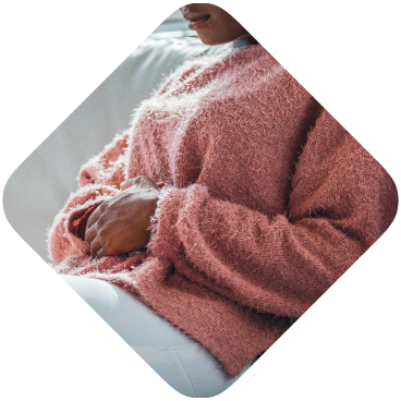 Woman lying on a couch and feeling unwell